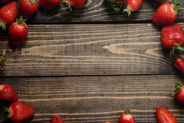 Close-up of fresh strawberries on the rustic background. Food frame background