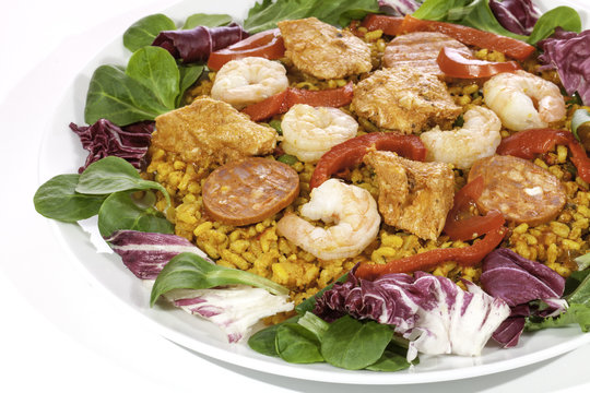 Spanish paella meal served cold with salad