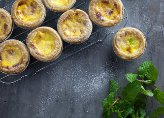 Egg tarts at wooden rustic background