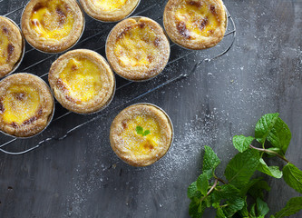 Egg tarts at wooden rustic background