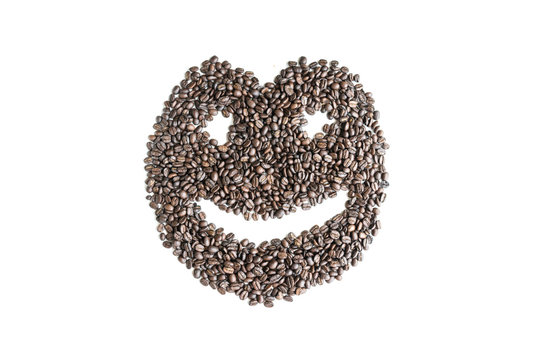 Coffee beans are arranged in a smiley image.