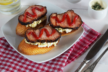 Sandwiches with ham and ketchup