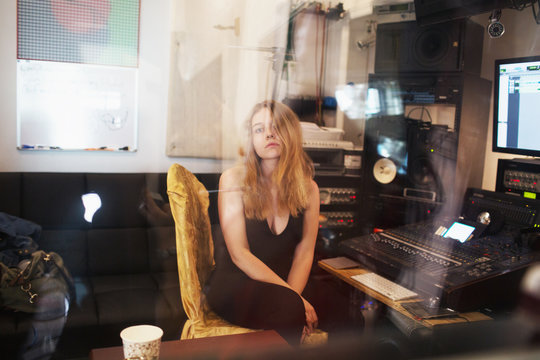 Young woman at a recording studio