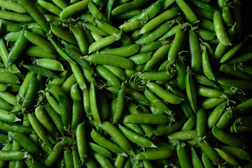 Green food background. Horizontal view. Peas  pods pattern