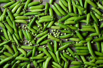 Green food background. Horizontal view. Peas  pods pattern