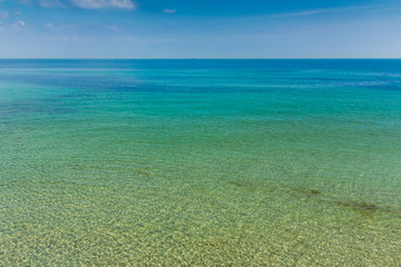 Clear sky and sea landscape. Hot sea summer shot on a sandy beach