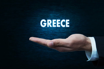 Hand holding Greece word