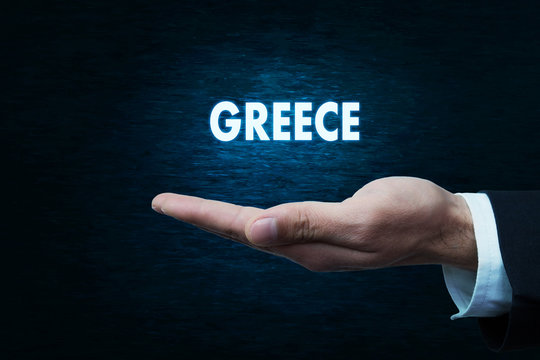Hand holding Greece word