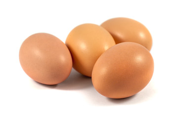 brown chicken eggs isolated on white background