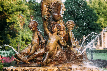 Fototapeta na wymiar Riga, Latvia. Fountain Nymph In Water Splashes In Aspazijas Boulevard