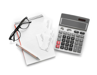 Gray calculator and notebook on white background