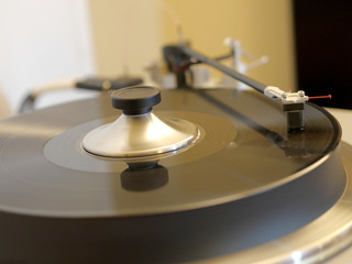 Audiophile HiFi turntable player with musical vinyl record.