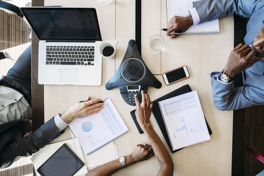 Overhead view of business people in board room