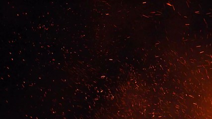 Burning ash rise from large fire in the night sky. - Powered by Adobe