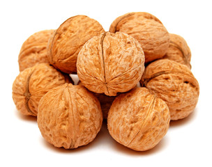 Dry walnuts in shell isolated on white background. Flat lay, top view