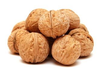Dry walnuts in shell isolated on white background. Flat lay, top view