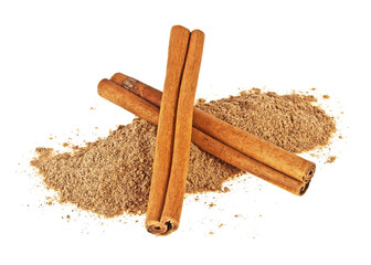 Two cinnamon sticks with powder on a white background