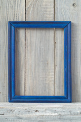 Obraz na płótnie Canvas Blue frame on white boards background