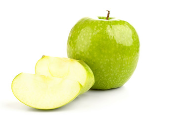Juicy fresh green apple and apple slices on a white background