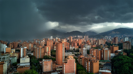 Medellin Colombia Rain storm with clouds approach city with buildings in shot. Latin / South America