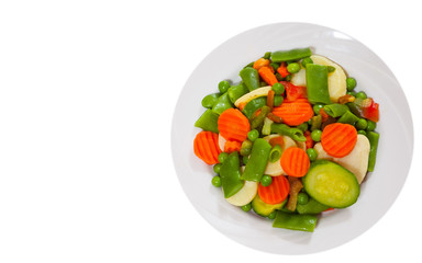 Mixed vegetables on a plate. top view. isolated on white
