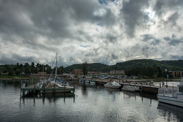 Fototapeta na wymiar boats at marina with dark clouds at Munising, Michigan