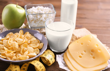 Different dairy products on wooden background