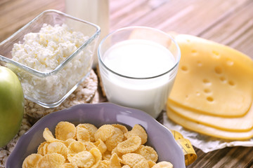 Different dairy products on wooden background