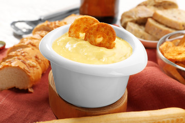 Bowl with beer cheese dip and toasts, closeup