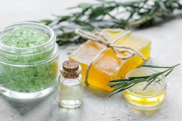 organic cosmetics with rosemary extract on stone table background