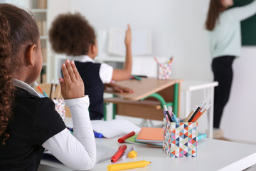 Cute African-American girls in classroom