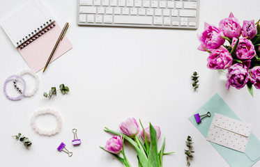Obraz na płótnie Canvas Woman office desk with flowers on white background top view mockup