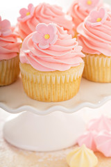 Vanilla cupcakes with pink raspberry frosting