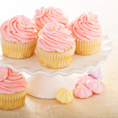 Vanilla cupcakes with pink raspberry frosting