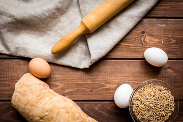 Dried crumbs with bread on kitchen table background top view mokeup
