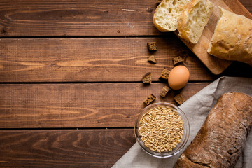 bakery concept with homemade bread on rustic background top view moke-up