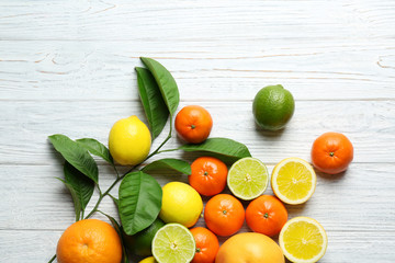 Beautiful composition of tropical fruits on wooden background