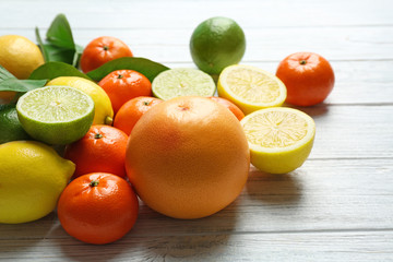 Beautiful composition of tropical fruits on wooden background