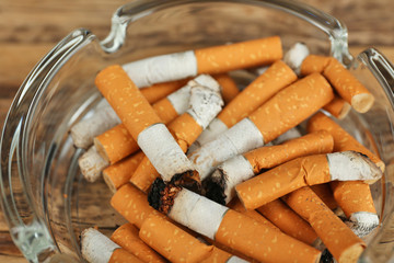 Cigarette butts in ashtray, closeup