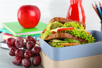 Meal for schoolchild in lunch box on table