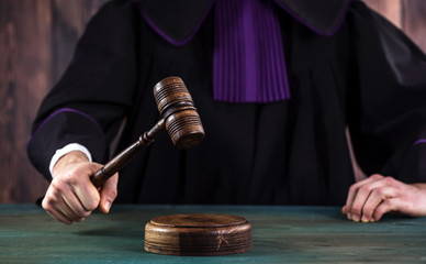 Law concept,Judge In A Courtroom Striking The Mallet © Aerial Mike