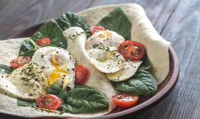 Tortilla sandwiches with poached eggs