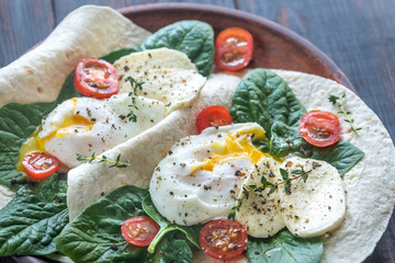 Tortilla sandwiches with poached eggs
