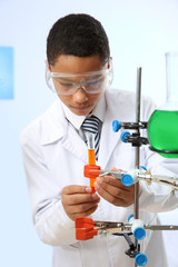 Fototapeta premium School boy making experiment in chemistry class