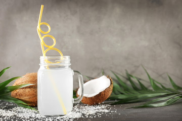 Beautiful composition with coconut water on table
