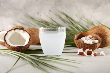 Beautiful composition with coconut water on table
