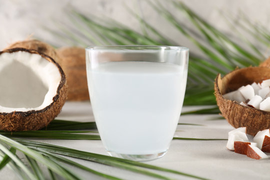 Glass of coconut water on table