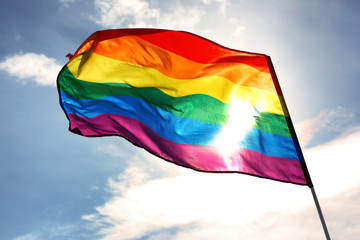 Gay flag on sky background