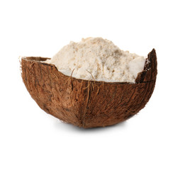 Coconut flour in half of nut on white background
