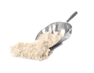 Metal scoop with coconut flour on white background